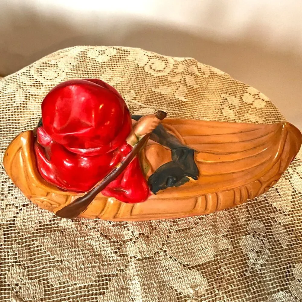 Rare 1920's Antique celluloid toy girl in a canoe; don't miss her!